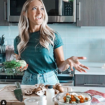 Middle aged woman coking in a kitchen