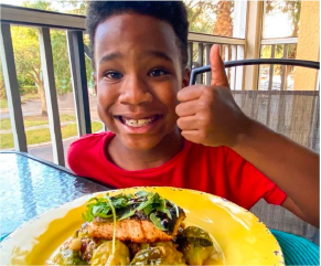 Annie F., customer testimonial photo showing child enjoying a meal