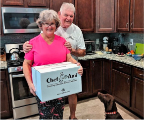 Anita & Lou S., customer testimonial photo with Chef Ami delivery box