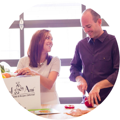 Johana and Matt Dickhaus, founders of Chef Ami, preparing meals together in the kitchen